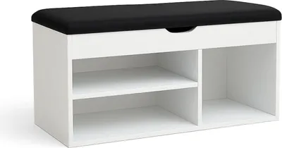 A white shoe cabinet with a black upholstered seat on top.