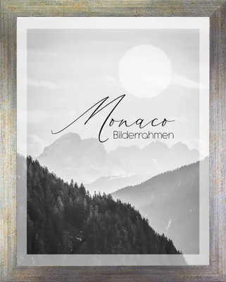 A framed black and white landscape photo of mountains with text overlay.