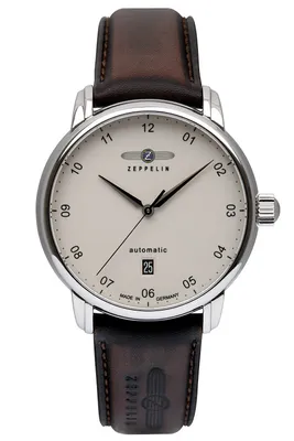 A close-up, front-facing view of a men's wristwatch with a leather strap.