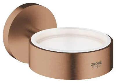 A close-up studio shot of a wall-mounted soap dish.