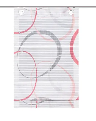 A close-up view of a window blind with a circular pattern.