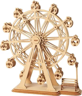 A wooden model of a Ferris wheel with a bench and lamppost at its base.