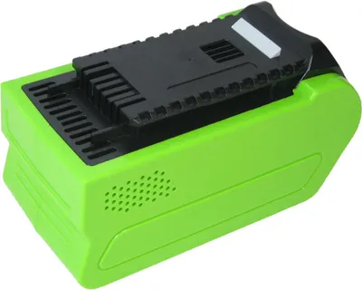 A green and black power tool battery pack is shown against a white background.