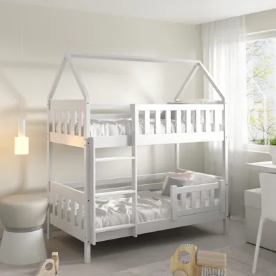 A white bunk bed with a house-shaped frame is shown in a child's bedroom. The beds are made with white linens. A stool and a wooden toy are visible in the foreground.