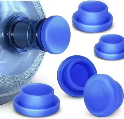 A collection of blue silicone bottle caps for water jugs.