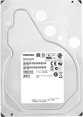 A close-up view of the top of a Toshiba hard drive with a label showing product information and certifications.