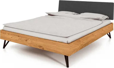 Produktbild von Bett Rolo 1 in 120x200 cm aus Wildeiche massiv mit Polsterkopfteil in Schwarz