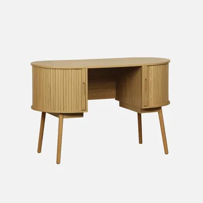 A wooden desk with curved sides and slatted doors.