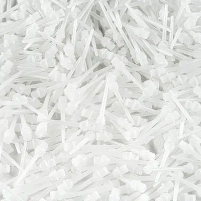 A pile of white dart tips.