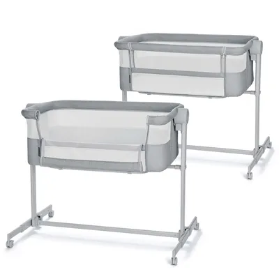 Two baby cribs are shown side-by-side against a white background.