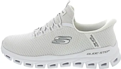 A side view of a white Skechers training shoe.