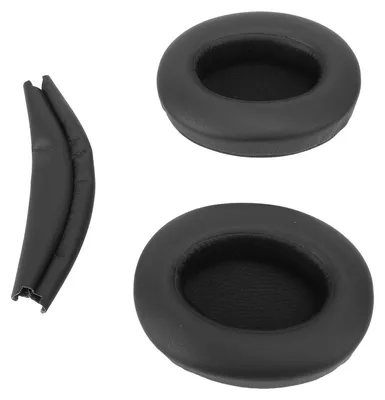 A set of black headphone ear pads and a black headband cover are laid out on a white background.