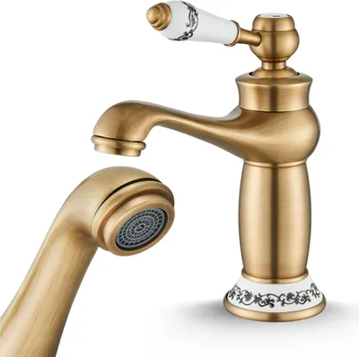 A close-up studio shot of a single retro-style faucet.