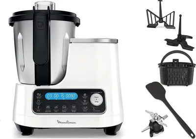 A white and silver food processor with various accessories displayed next to it on a white background.