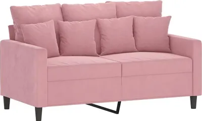 A pink sofa with pillows on a white background.