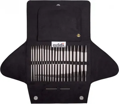 A set of knitting needles laid out in a black case.