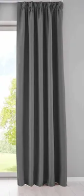 A dark gray curtain hangs in front of a window, with a hint of greenery visible outside.