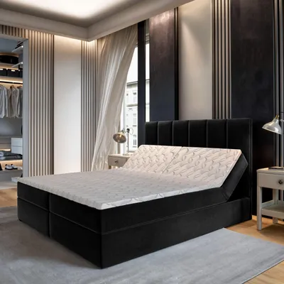 A bedroom scene with a bed, closet, and window.