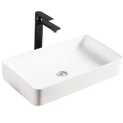 A white rectangular basin with a black faucet.
