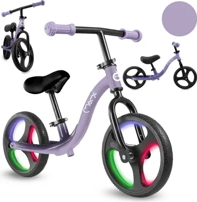 Produktbild von MoMi ISOKA – 10 Zoll Laufrad mit LED-Leuchten (Dynamo), höhenverstellbar ohne Werkzeug, mit Fußstütze, ab 2 Jahren, bis 35 kg – Lila