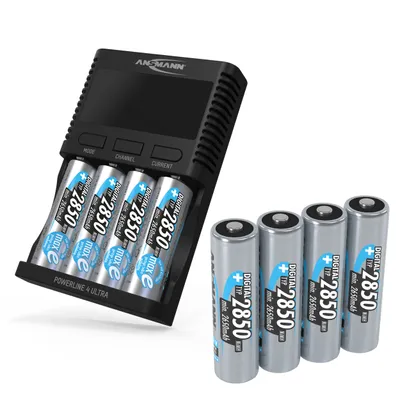 A battery charger with batteries inserted and loose batteries next to it.