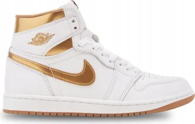 A white and gold high-top Nike Air Jordan 1 sneaker is shown from the side against a white background.