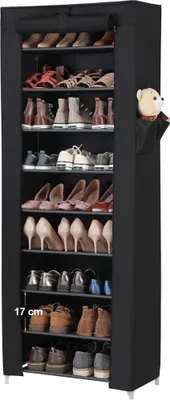 A tall, black shoe rack filled with various shoes on multiple shelves, with a small teddy bear peeking out of a side pocket.