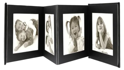 A black photo album with multiple frames showing children's photos.