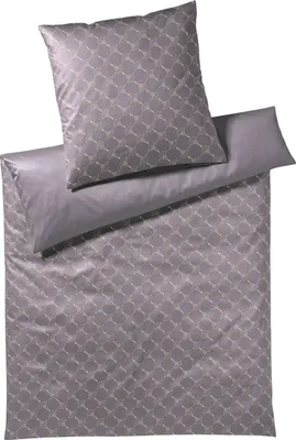 A folded duvet cover and pillowcase with a geometric pattern.