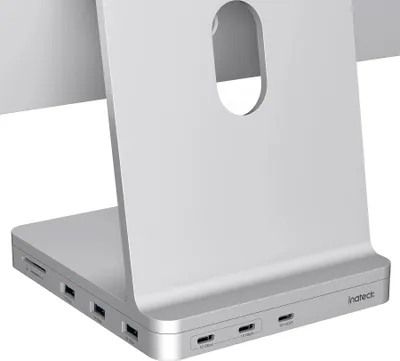 Close-up of the back of a silver computer docking station with multiple ports.
