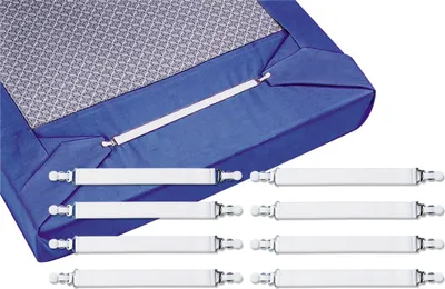 A close-up view of a blue fitted sheet corner with white elastic straps attached, along with several loose white elastic straps with clips.