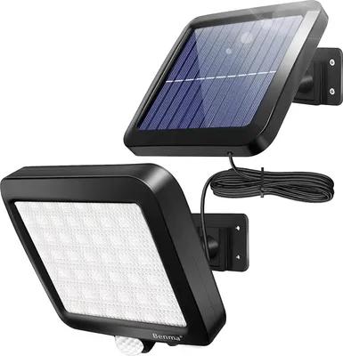 A solar-powered outdoor light with a separate solar panel connected by a wire.
