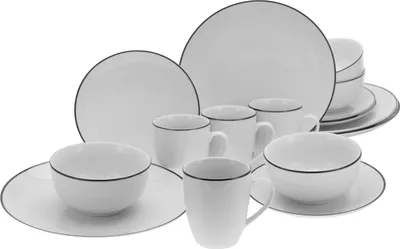 A set of white ceramic dishes with a black rim, including plates, bowls, and mugs, arranged on a white background.