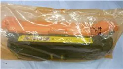 A product inside a plastic bag, likely a toner cartridge.