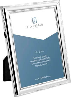 A silver photo frame with a beaded edge, shown at an angle on a white background. The frame has a blue insert with text and a logo.