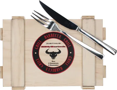 A set of BBQ steak knives and forks presented on a wooden box.