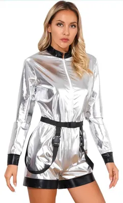 A woman is modeling a silver jumpsuit.