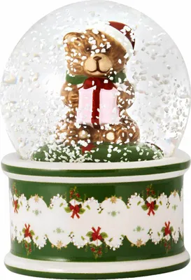 A Christmas-themed snow globe featuring a teddy bear holding a gift.
