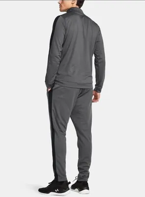 A man wearing a grey tracksuit.