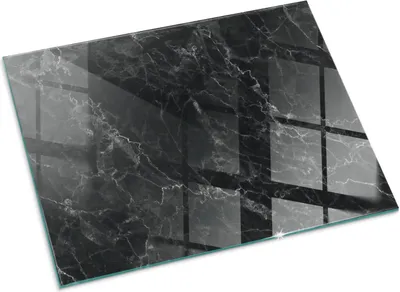 A black marble patterned glass floor plate for a fireplace.