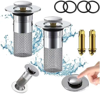 Immagine prodotto di Tappo universale per lavabo Ibbenzoa® con filtro anticalcare e antigoccia, a scomparsa, in rame e acciaio inossidabile 304, con anello in silicone, colore argento, dimensioni 8x6x3 cm, adatto per fori di diametro 34–40 mm