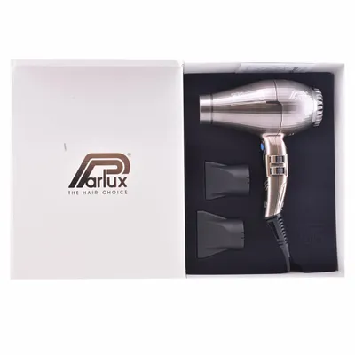 A hairdryer and its accessories are displayed inside an open box.