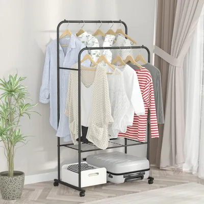A clothing rack with clothes and a suitcase.