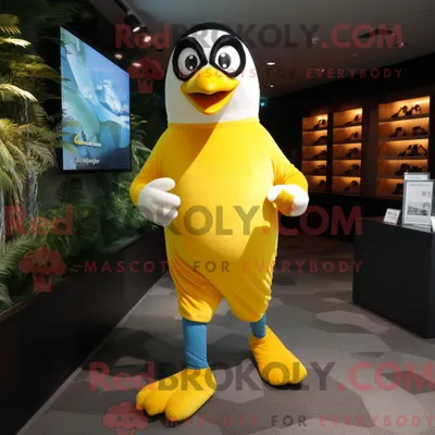 Produktbild von Maskottchenkostüm REDBROKOLY eines gelben Pinguins mit Laufshorts und Handschuhen