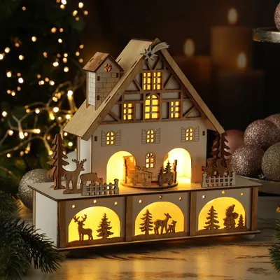 LED Weihnachtshaus mit Musik und drehendem Karussell - beleuchtete Weihnachtsszene - H: 25cm