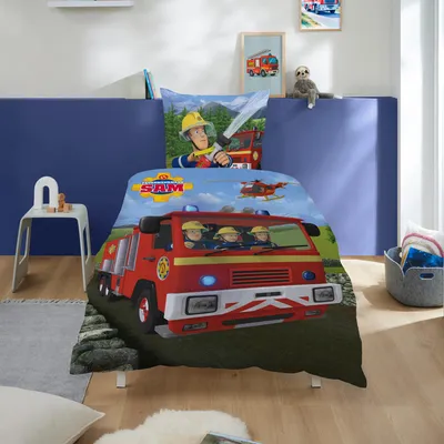 A child's bedroom with a Fireman Sam themed duvet set on a bed.