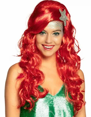 A woman wearing a red wig and a green sequined top, styled as a mermaid.