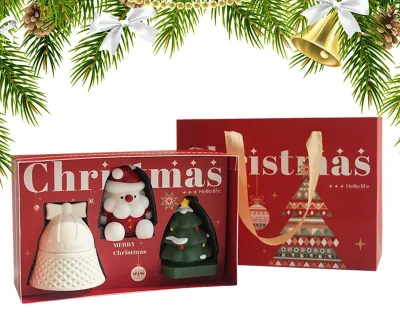 Produktbild von Set mit 3 festlichen Duftkerzen mit weihnachtlichen Motiven