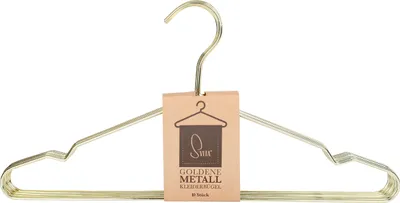 A set of golden metal hangers with a tag attached.