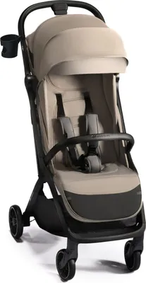 A studio shot of a beige and black stroller.